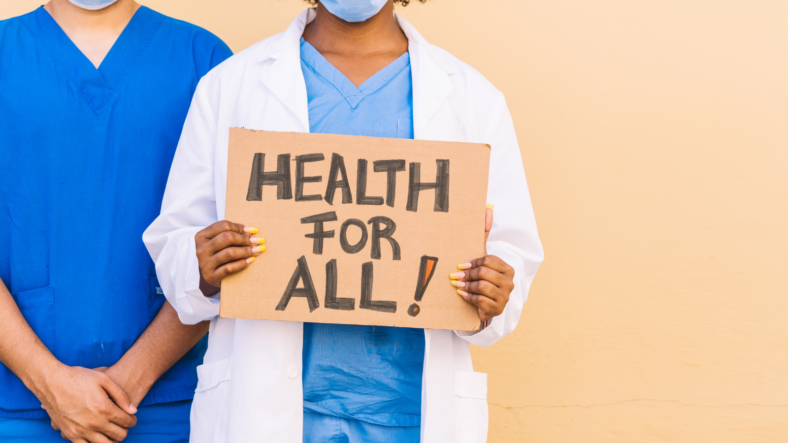 Person holding a sign saying health for all